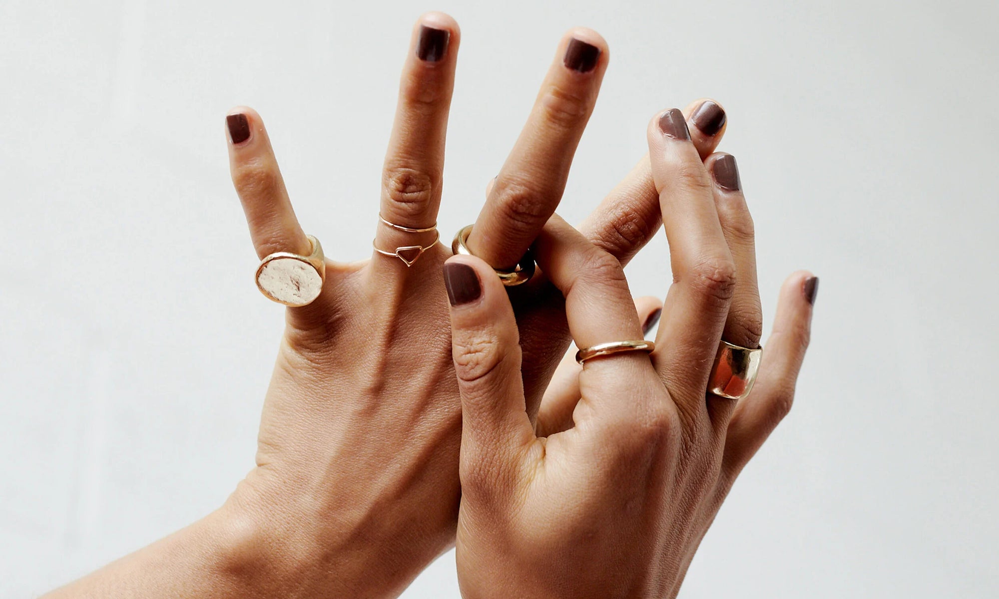 From left: The Ra Pinky Signet, Triangle Ring, Rollo Band, Petite Rollo Band, and Demeter Cigar Ring. All handmade in recycled 14k gold using traditional lost wax casting techniques.