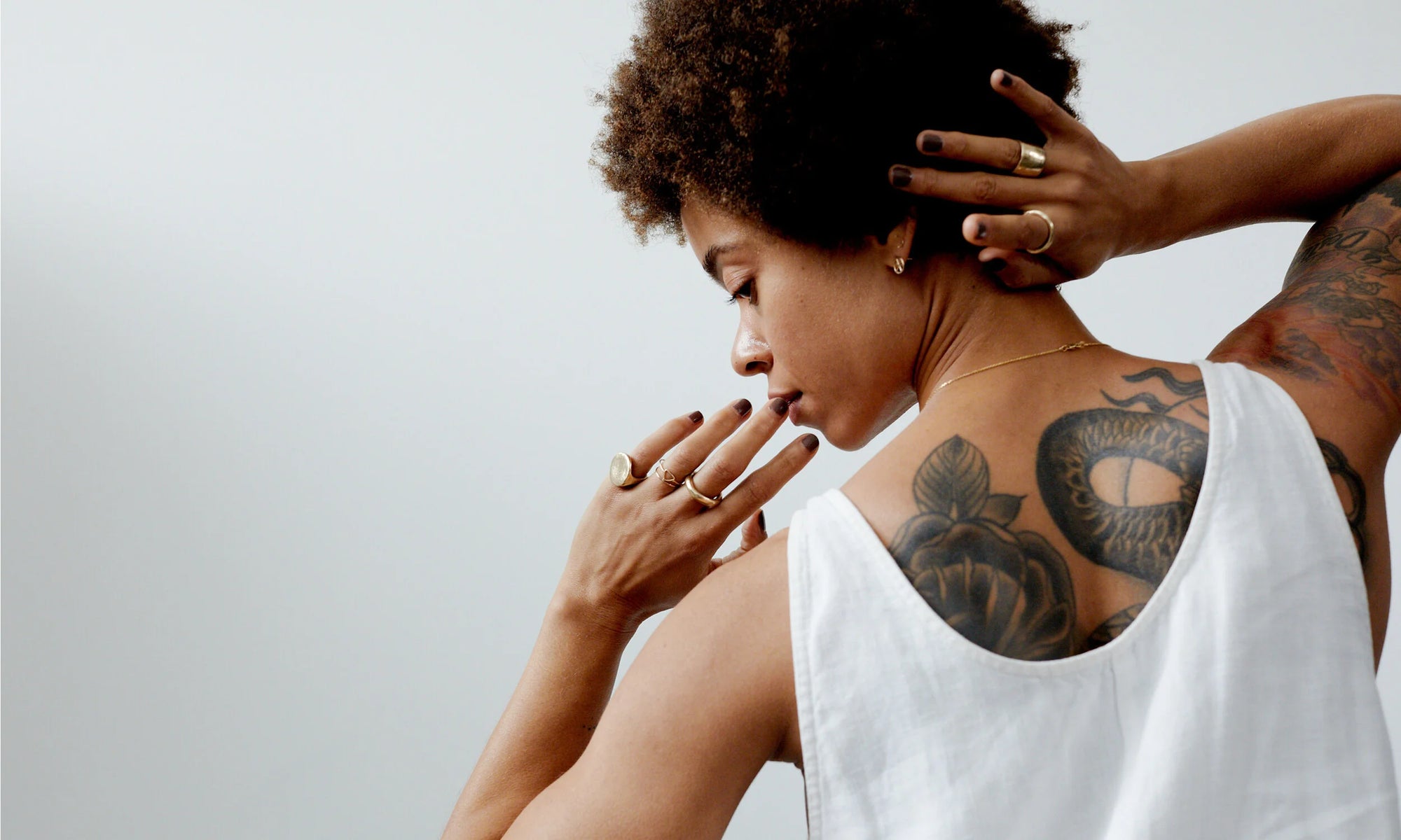 In the grace of the moment. The Ra Pinky Signet, Triangle Ring, Rollo Band, Petite Rollo Band, and Demeter Cigar Ring, along with the Peace Sign and Outward Arc Studs. All handmade in recycled 14k gold.