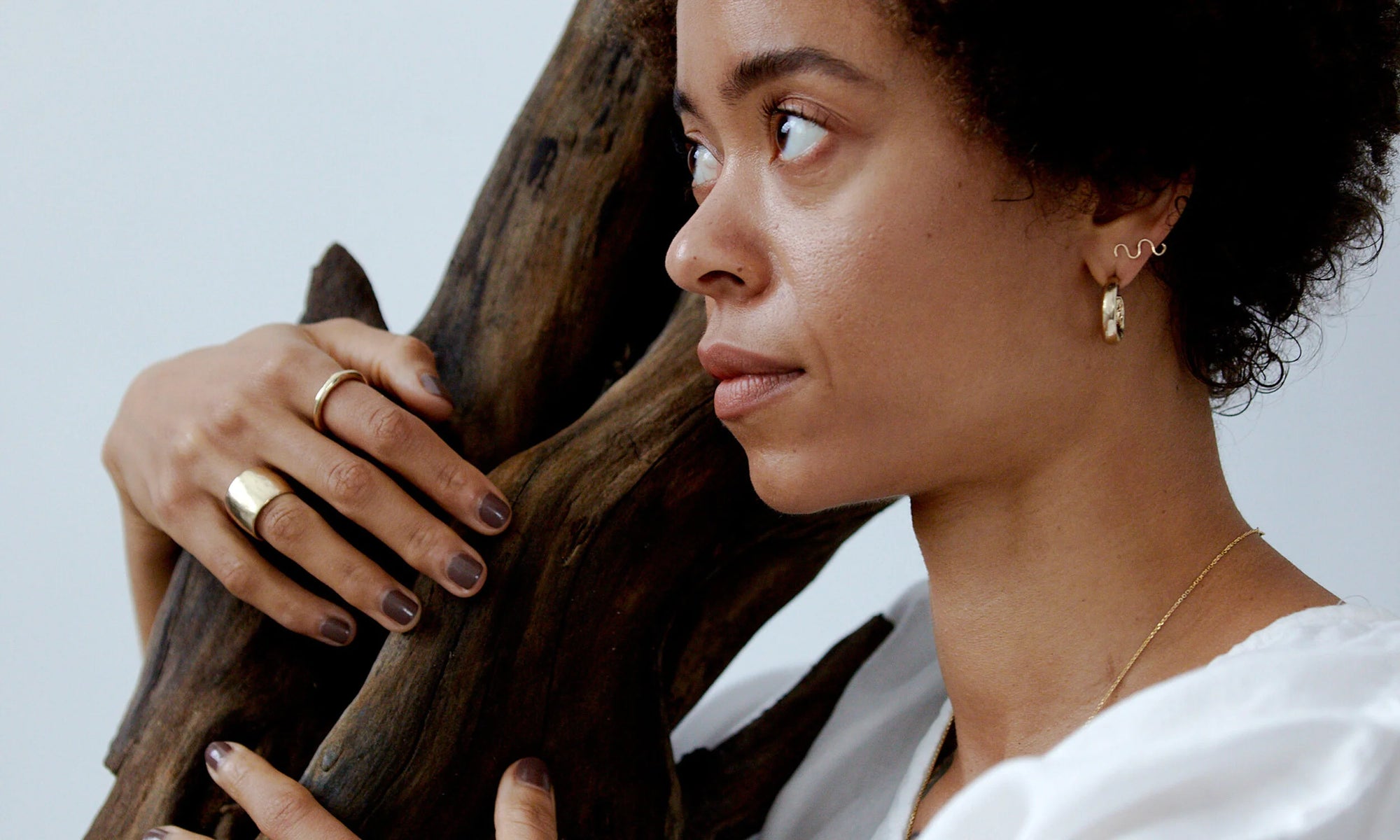 Model Niki wears hand carved and hand formed jewelry from the Alchemy 2020 collection. All pieces made from recycled 14k gold with love.