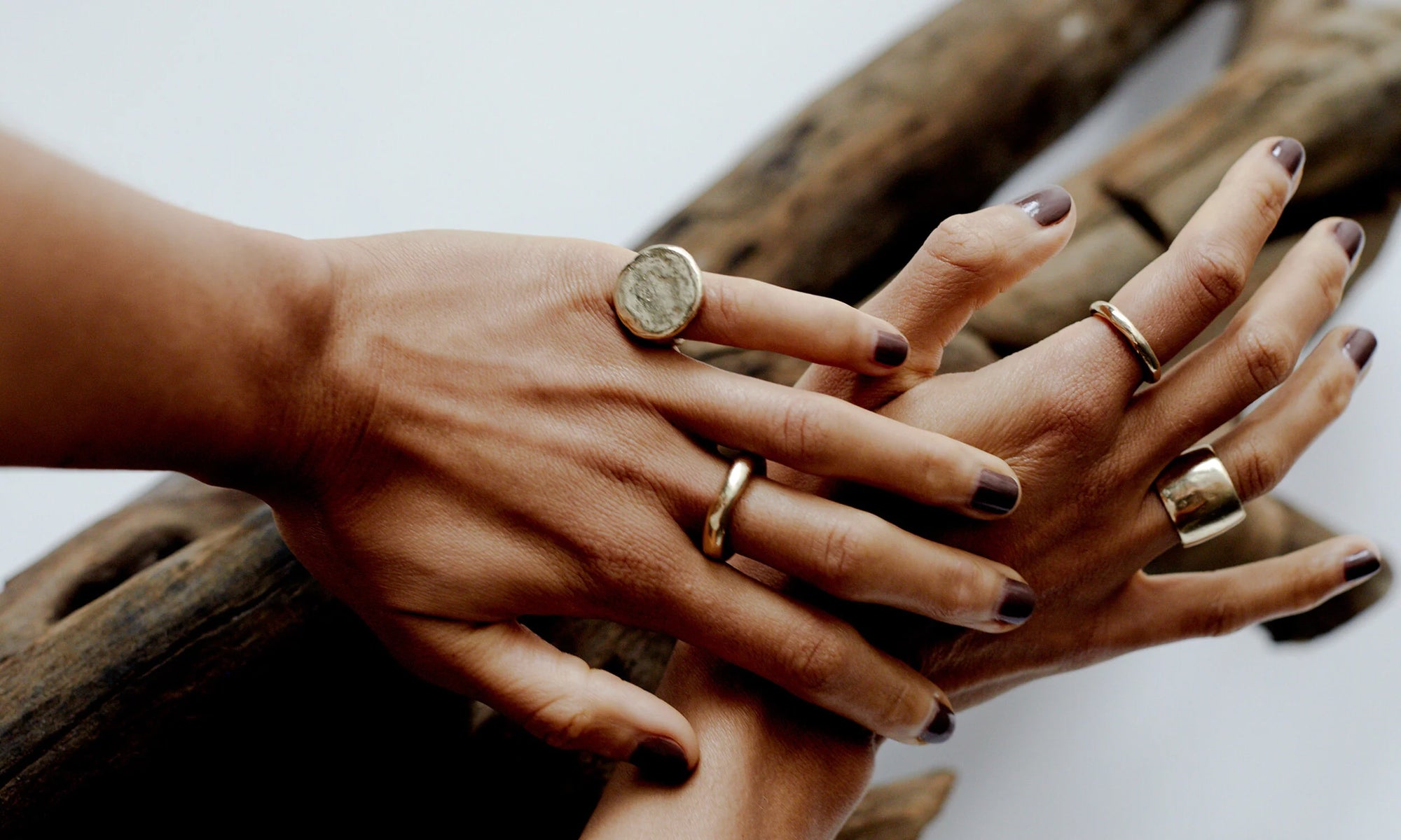 Niki wears recycled 14k gold rings from the Alchemy Collection, each one hand carved and cast using traditional lost wax casting techniques.
