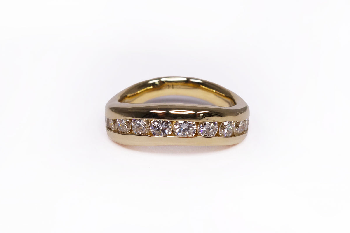 talisman fine jewelry jill channel set diamond band, made with solid recycled 14k gold and a row of natural round diamonds
