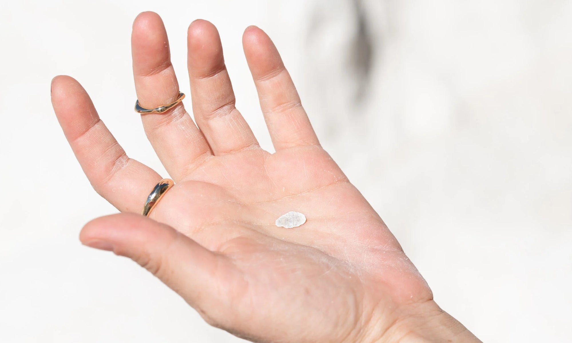 On hand are the Portal Ring and Sirius C Ring, both handmade in recycled 14k gold.