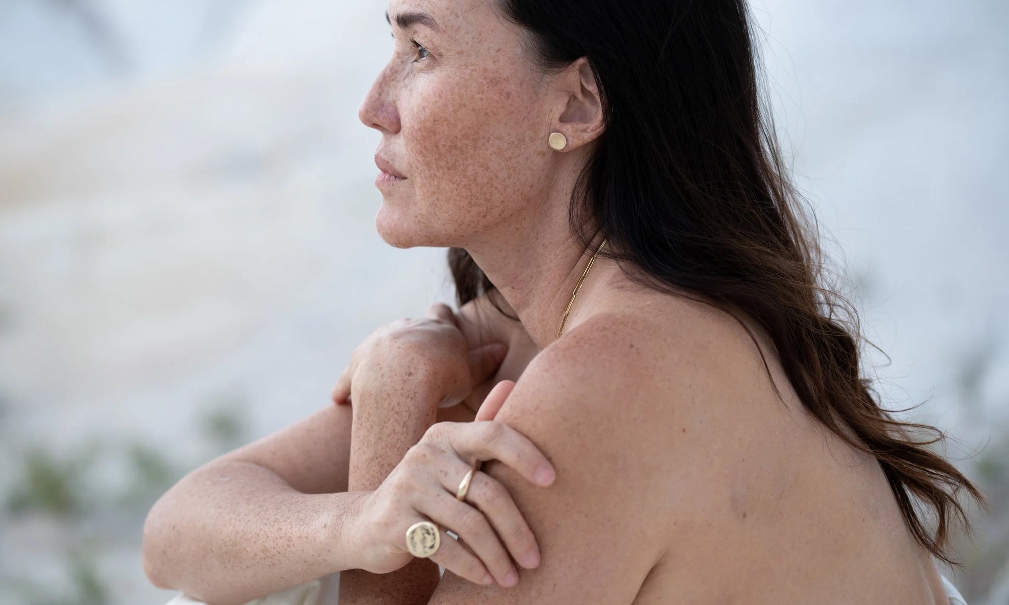 From top down: The New Orb Studs, Portal Ring, and Ra Pinky Signet. All sustainably handmade in recycled 14k gold.
