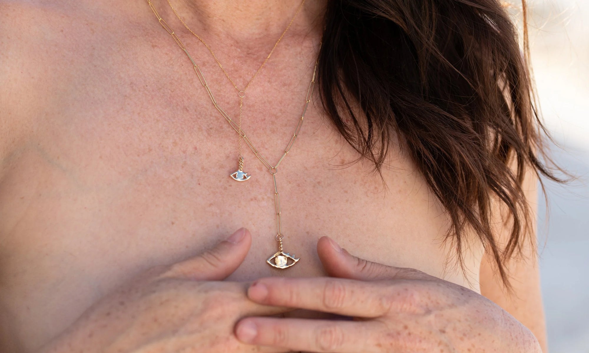 Double protection: The Protective Eye Y Necklace, and the Mini Protective Eye Y Necklace, both handmade in recycled 14k gold.