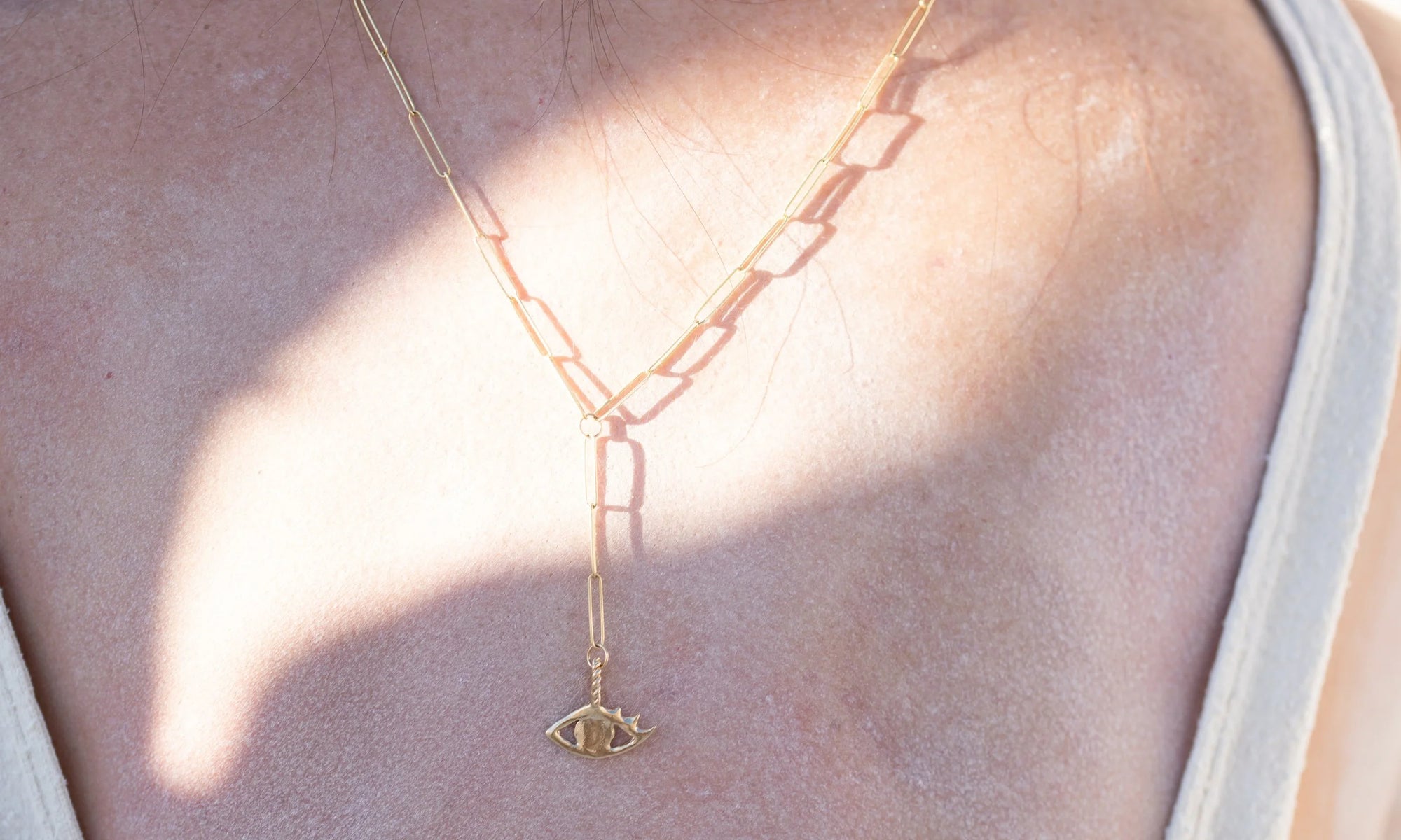 The full-sized Protective Eye Y Necklace. Handmade in 14k recycled gold and charged with intention for your protection.