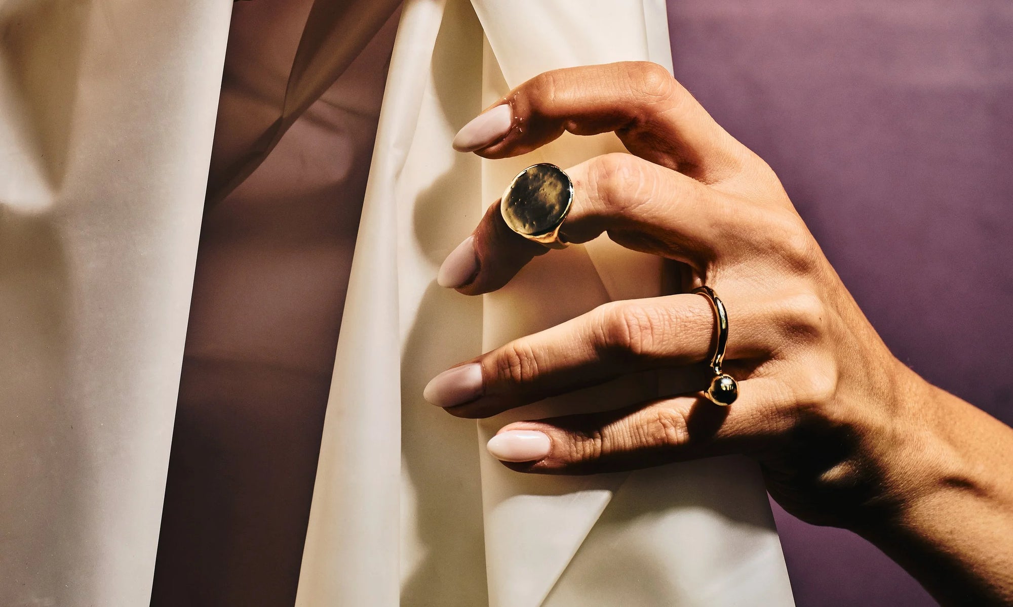 Model Vanessa Luka wears the Ra Signet and new Central Sun Ring, both entirely handmade in recycled 14k gold, using traditional lost-wax casting techniques.