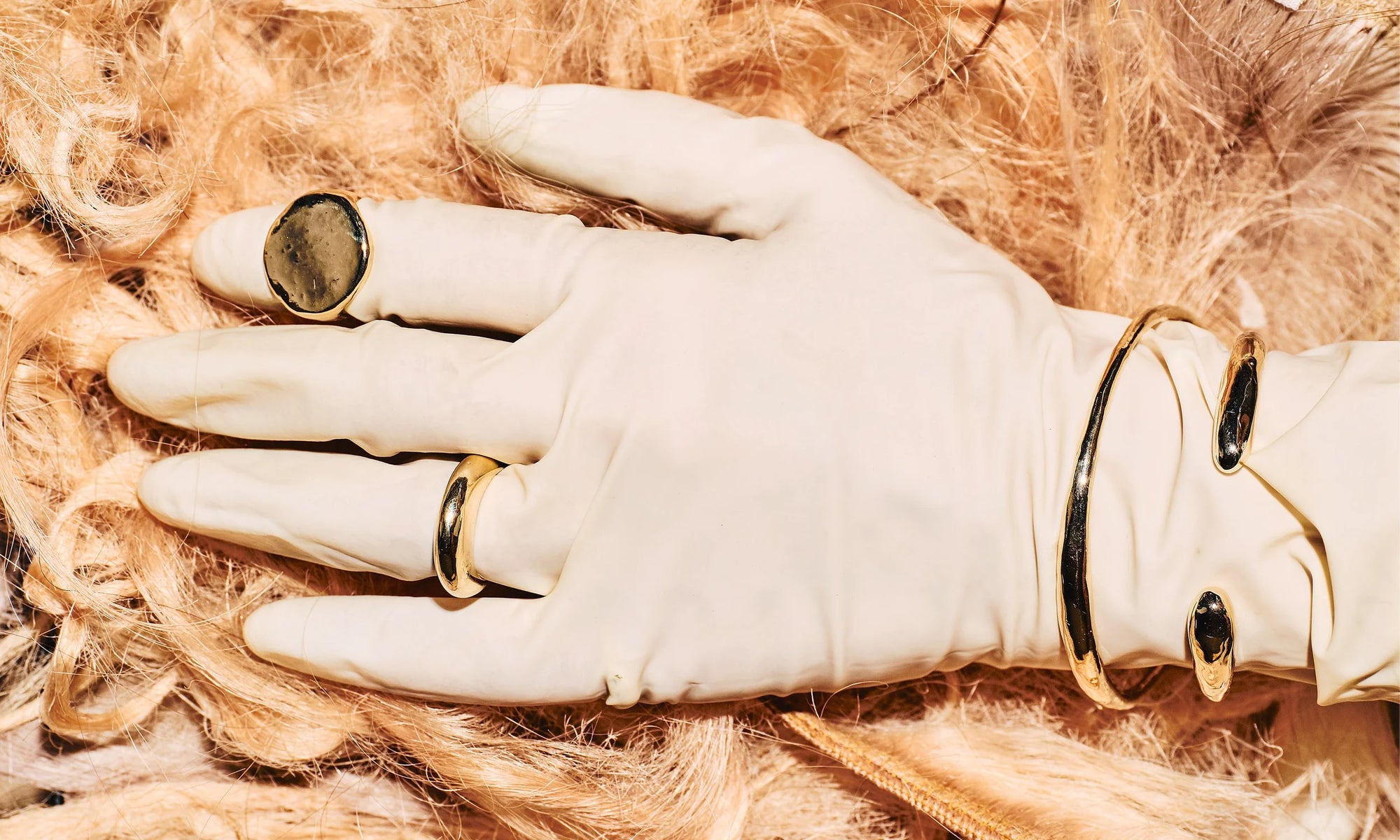 Cast the old-fashioned, analog way, each piece here is handmade in recycled 14k gold. From top left: The Ra Signet, Persephone Ring, and the Portal Bracelet and Inverse Cuff.