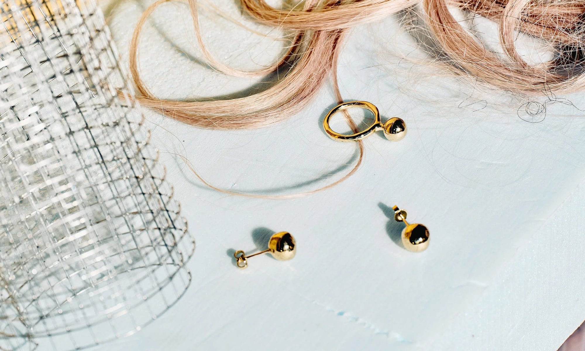 The Central Sun Earrings and their match, the new Central Sun Ring. All entirely handmade in lost-wax casting in recycled 14k gold.