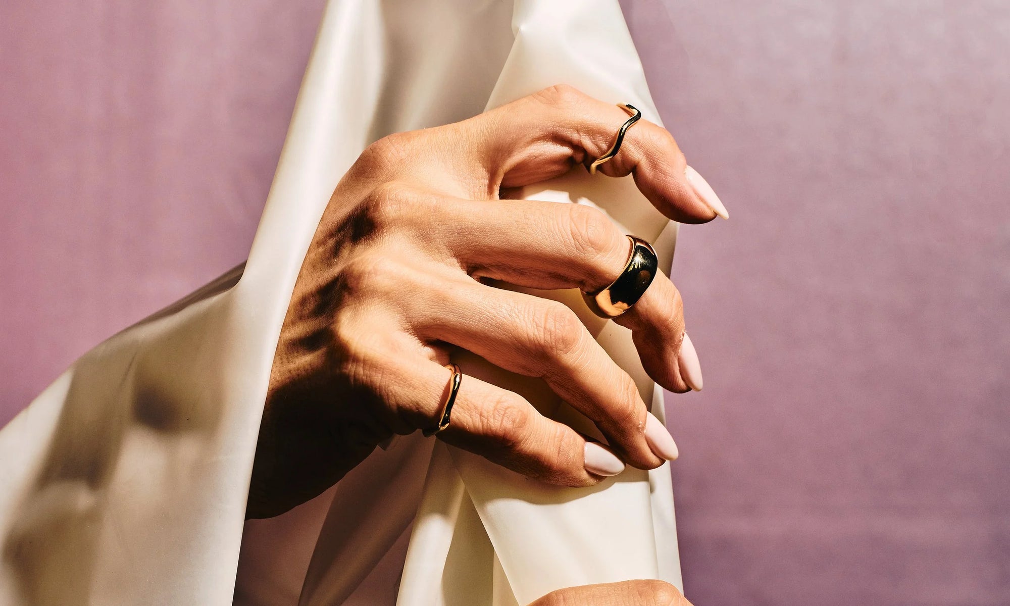 Model Vanessa Luka wears the Wave Theory Ring, the new Conjunct Cigar Band, and the Sirius C Ring. All entirely handmade in recycled 14k gold, using traditional lost-wax casting techniques.