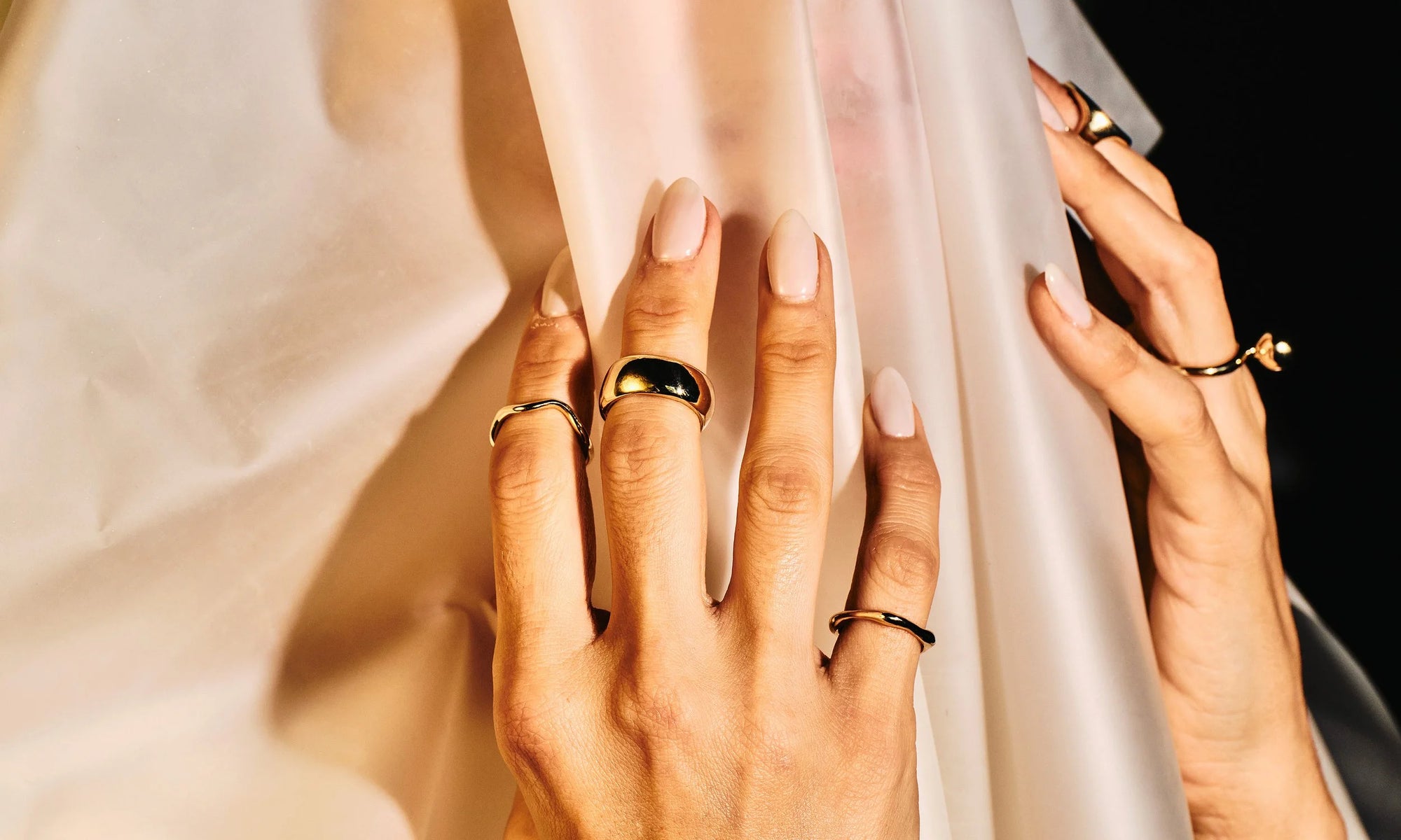 Model Vanessa Luka wears, from left: Wave Theory Ring, Conjunct Cigar Band, Sirius C Ring, Central Sun Ring and the Ra Pinky Signet. All sustainably hand-sculpted and cast in recycled 14k gold.
