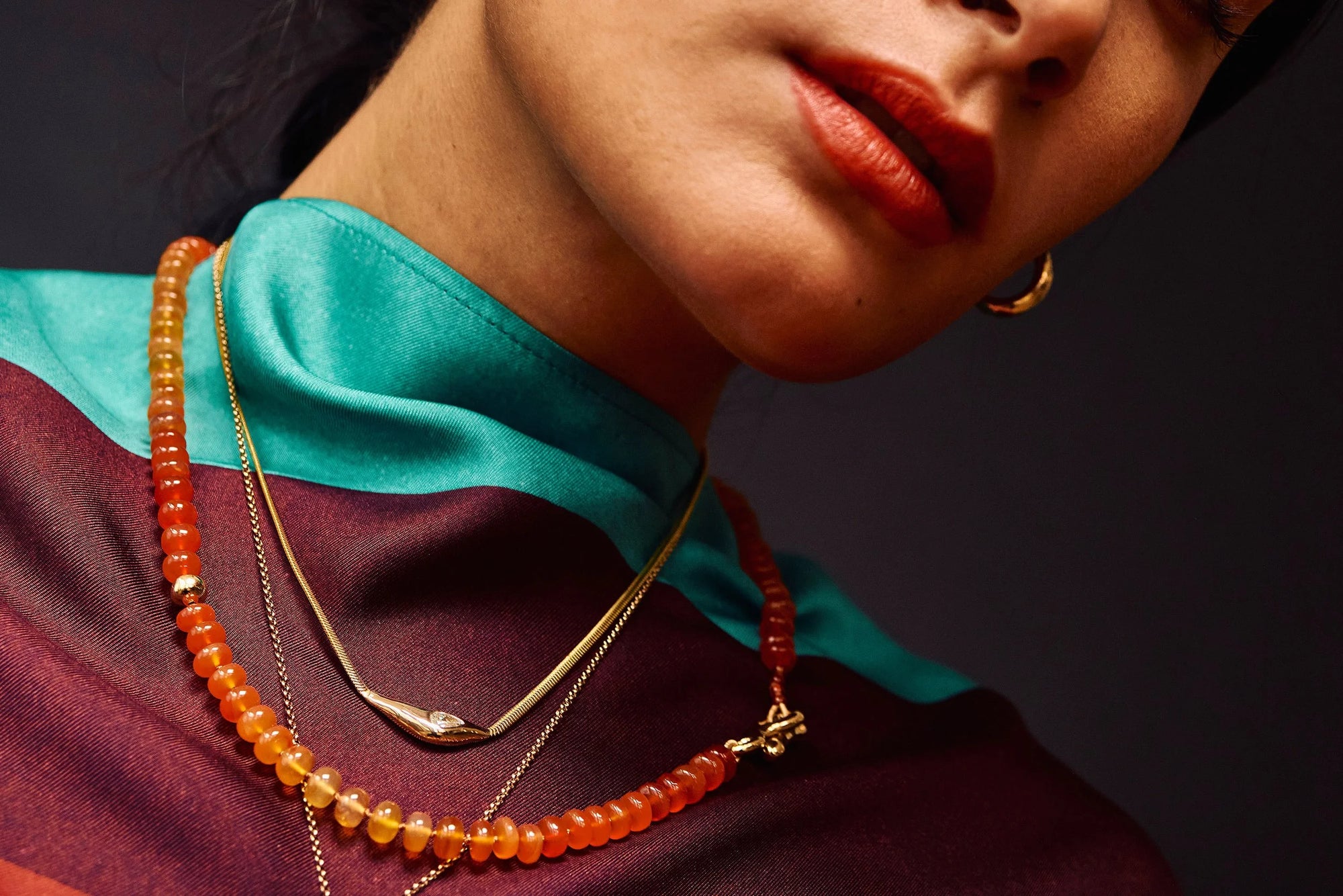 Model Thaiara wears Rollo Hoops, Where The Light Comes Through Necklace, and the Prayer Necklace in Carnelian.