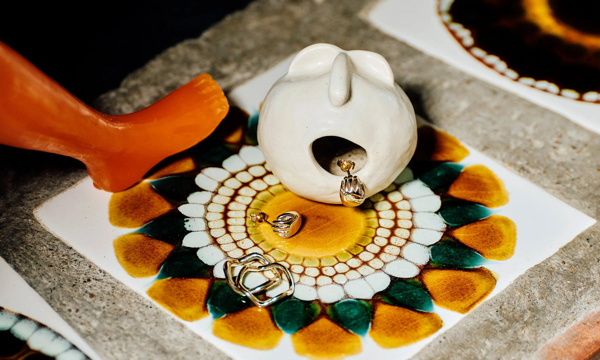 From left: the Shapeshifter Ring, Wave Theory Ring, and Held Earrings.