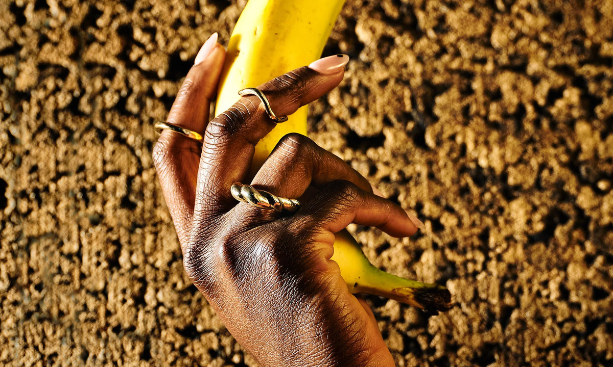 Samantha wears the Petite Rollo Band, Shapeshifter Ring, and the Helix Ring. All sustainably hand sculpted and cast in recycled 14k gold.