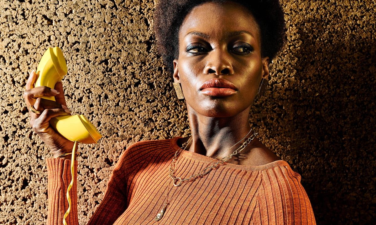 Model Samantha wears, from left, the Persephone Ring, Inverse Cuff, Plane Earrings, Metanoia Chain, and Held Necklace. All sustainably handmade in recycled 14k gold.