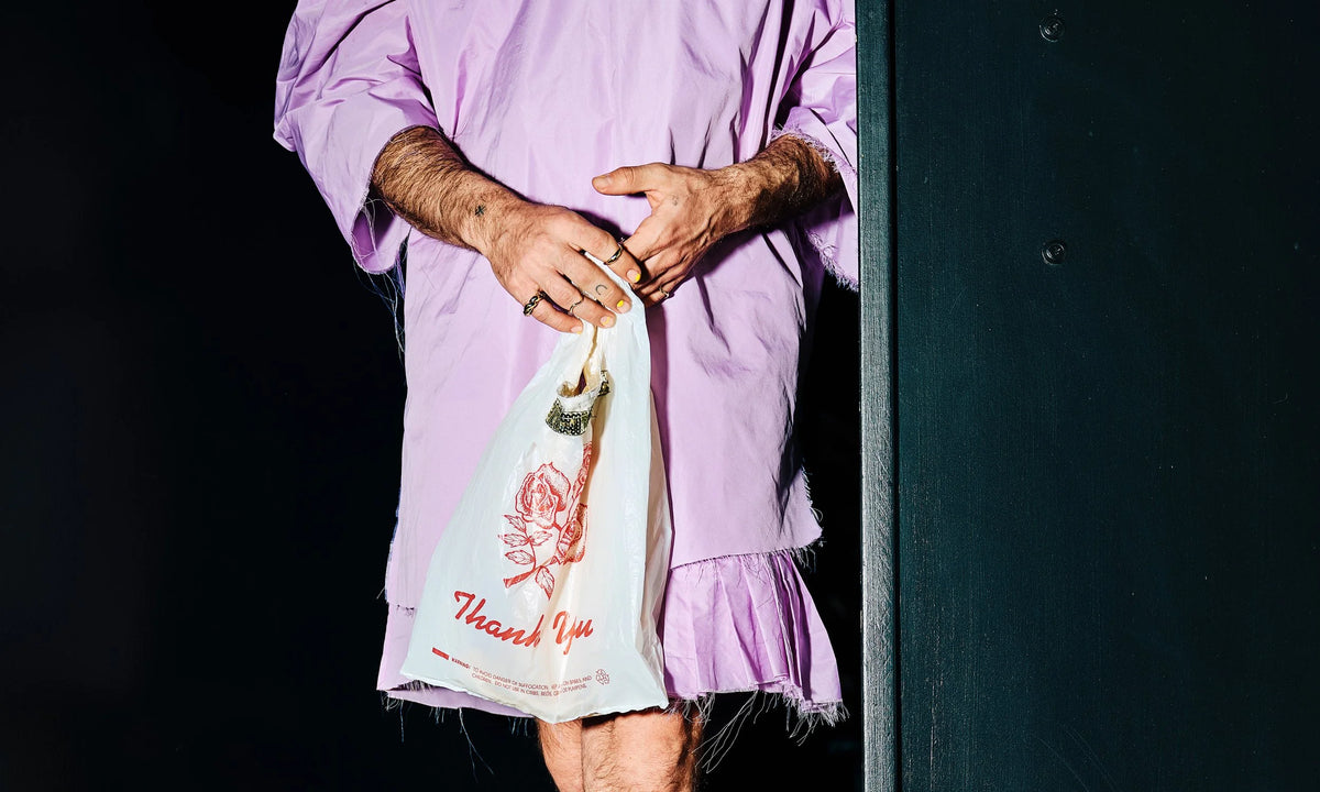 River wears, from left, the Helix Ring, Wave Theory Ring, Portal Ring, and the Shapeshifter Ring. Lilac dress and bag by Kate Towers.