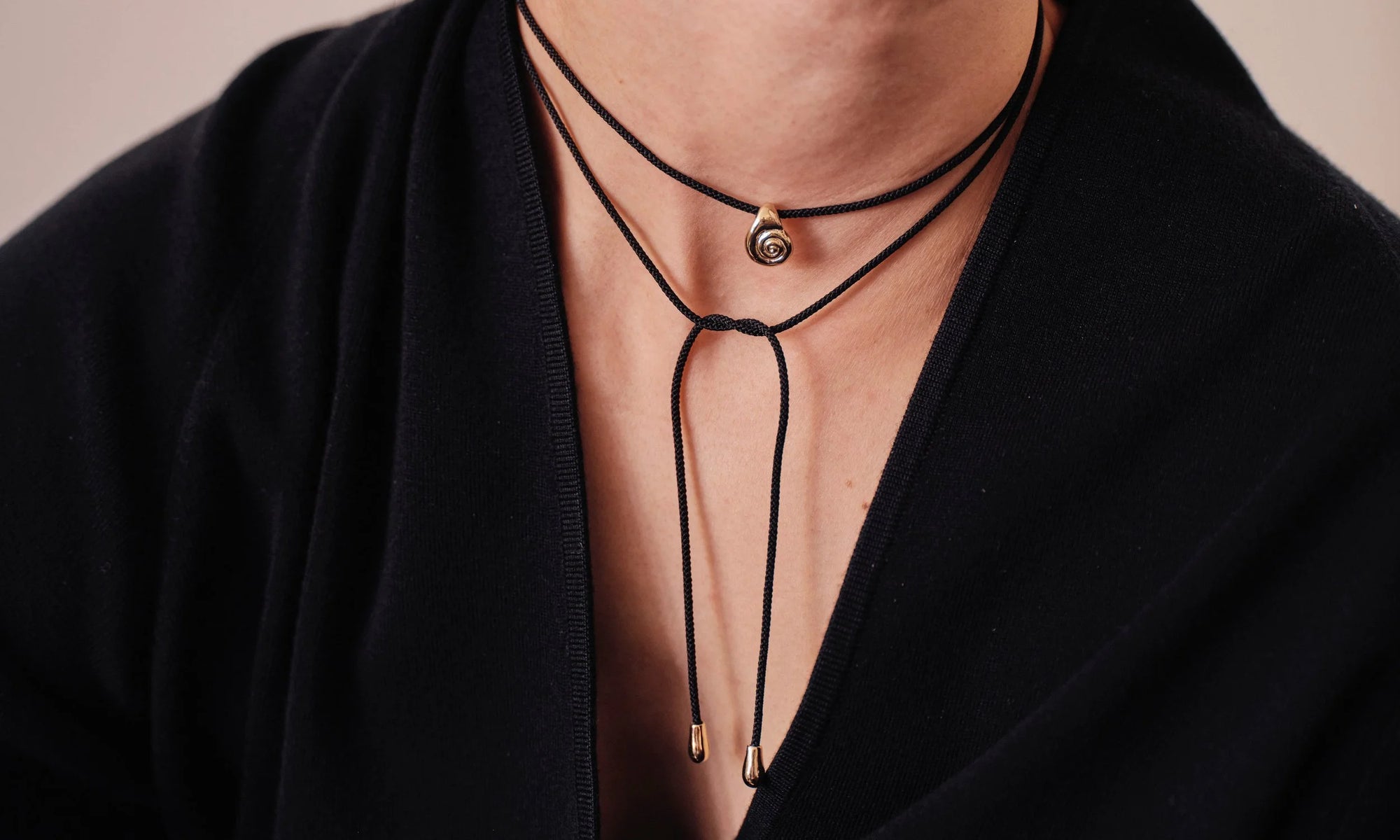 The Growth Necklace is available on a hand-braided Japanese silk cord with 14k end drops. Handmade in recycled 14k gold.