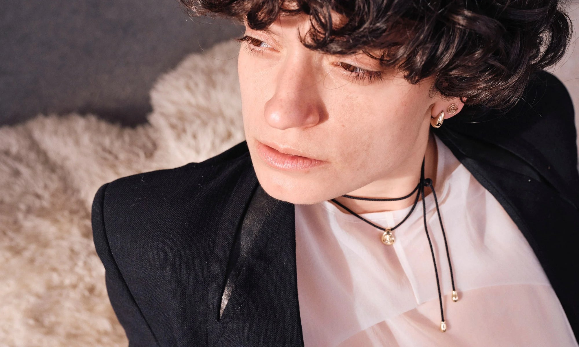 Erika wears the Sanguine Stud Earrings and Spiral Stud, along with the Growth Necklace on silk cord. Handmade in recycled 14k gold.