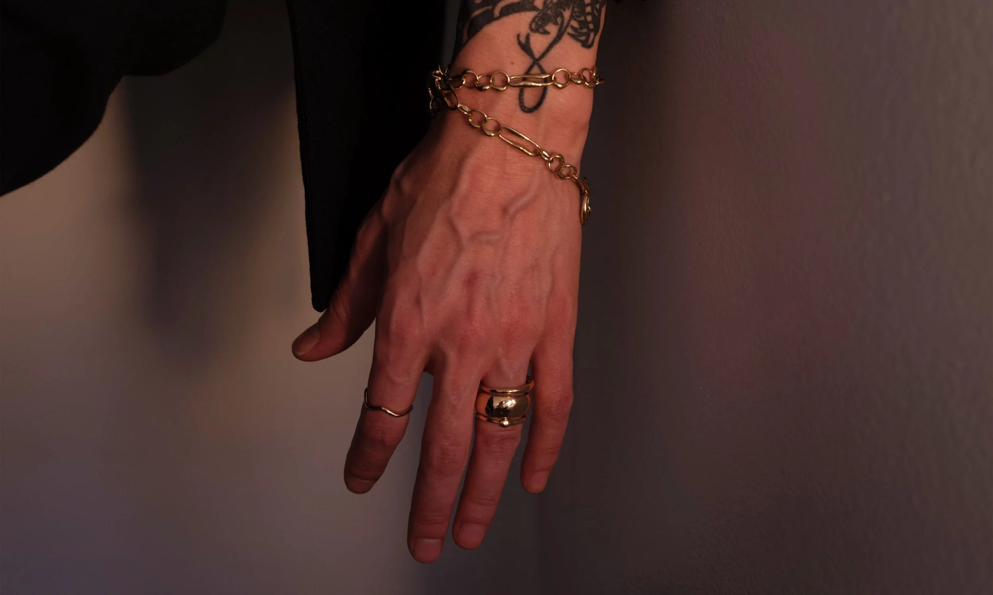 From top: the Metanoia Bracelet (doubled), the Portal Ring, Conjunct Cigar Band, Ouroboros Ring. Handmade in recycled 14k gold.