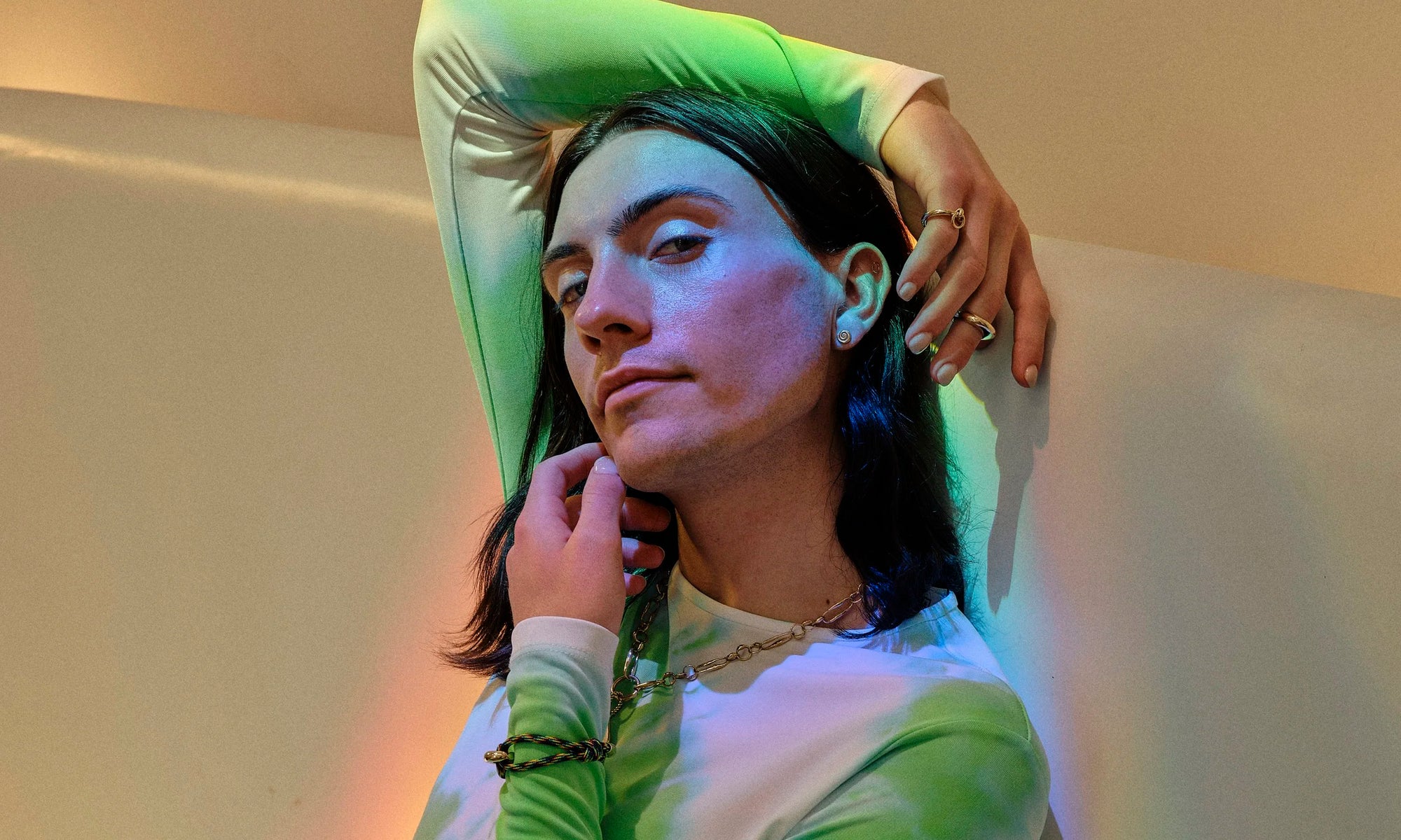 Hand-sculpted, recycled 14k gold jewelry created by Talisman Fine Jewelry. Apple wears the Growth Studs, Dance Bracelet, Interdependence Ring, Persephone Ring, and Metanoia Chain.