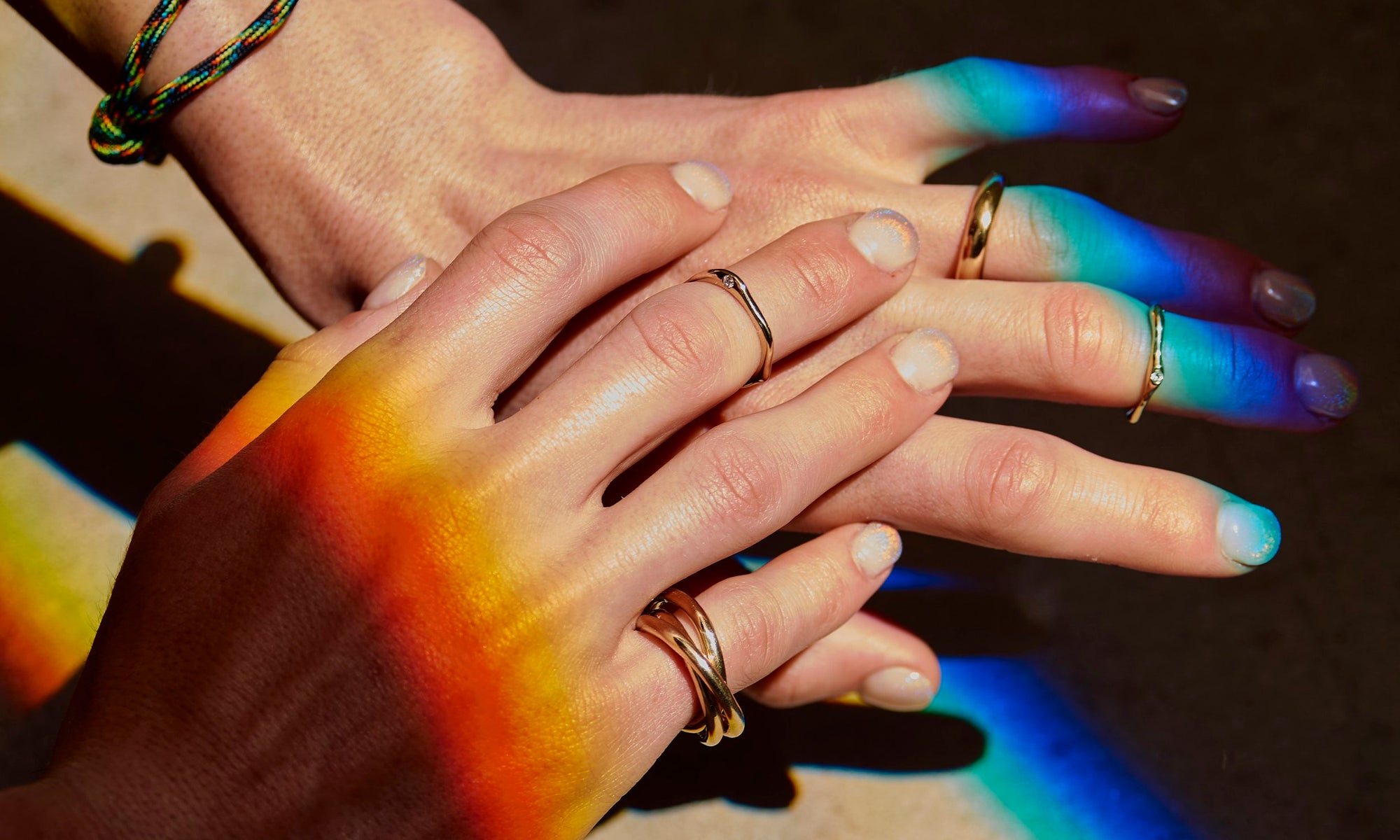 Minimalist, recycled 14k gold rings with reclaimed diamonds handmade by Talisman Fine Jewelry. Apple wears the Interconnection Trio Ring, Diamond Sirius B Ring, Diamond Sirius C Ring, Rollo Band, and Dance Bracelet.