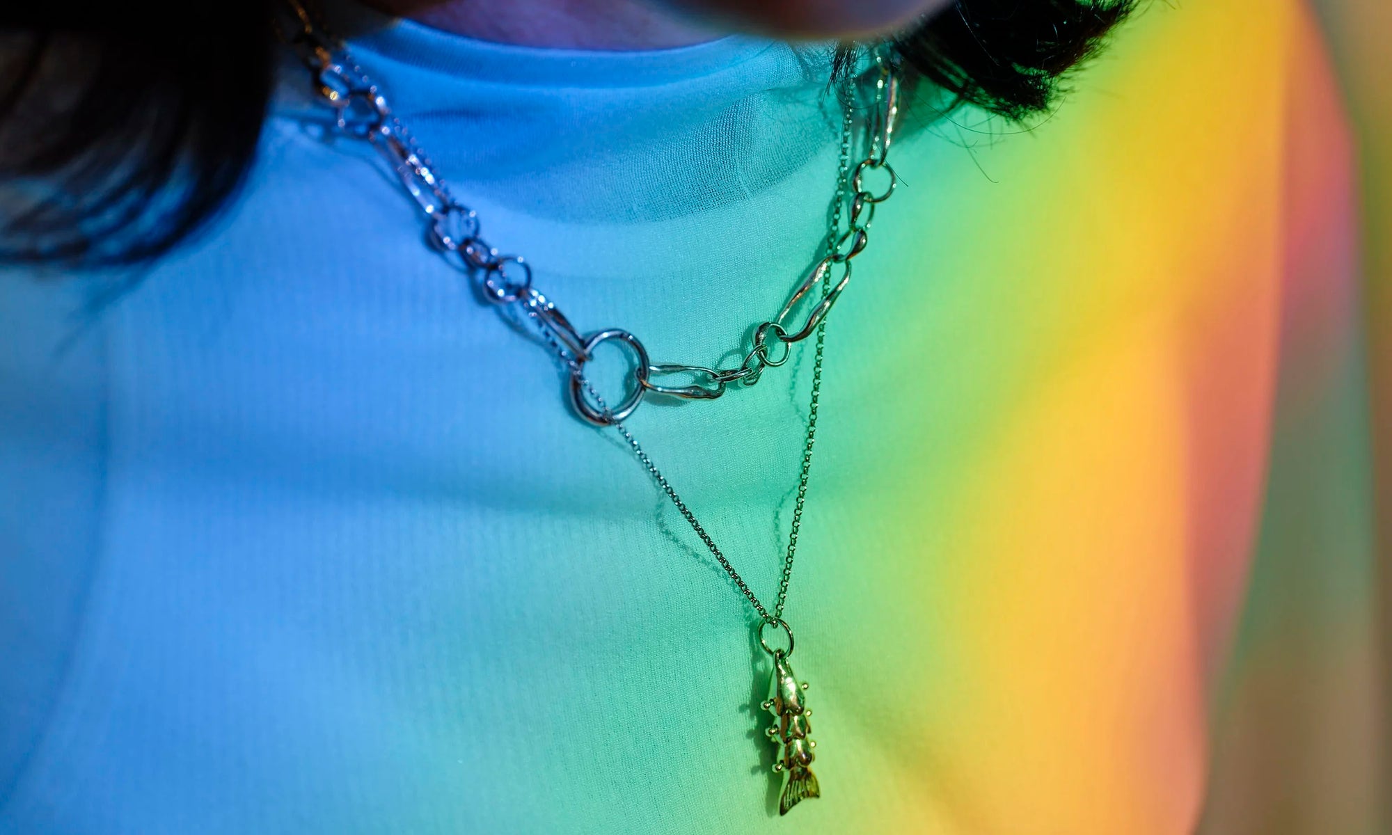 Handmade and hand-sculpted gold chain necklace and 14k solid gold fish pendant made by Talisman Fine Jewelry. Apple wears the Piscean Dream Necklace and the Metanoia Handmade Chain.