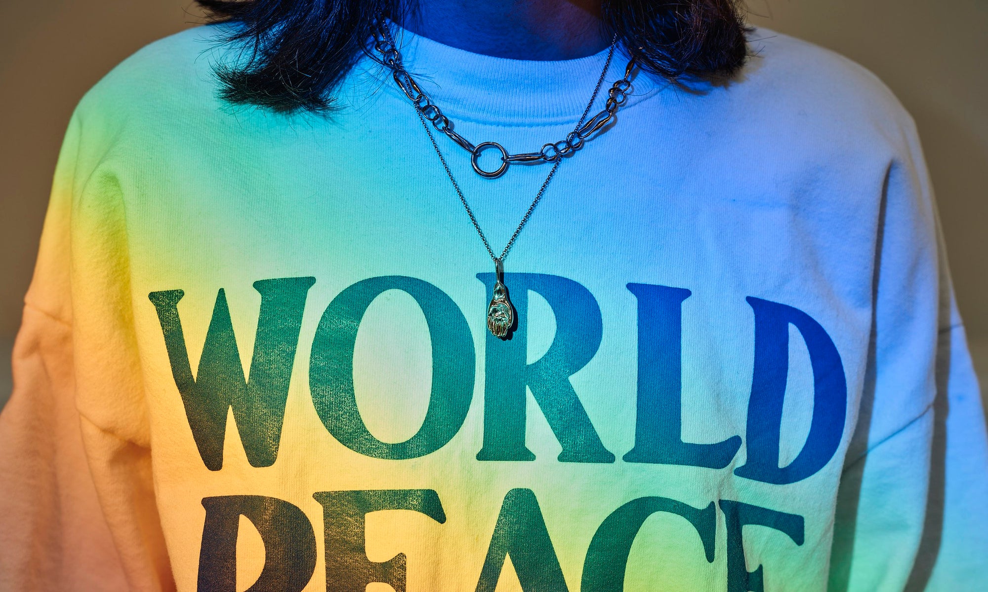 Ethically sourced, hand-sculpted 14k gold necklaces made from recycled gold by Talisman Fine Jewelry. Apple wears the Held Necklace and the Metanoia Handmade Chain.