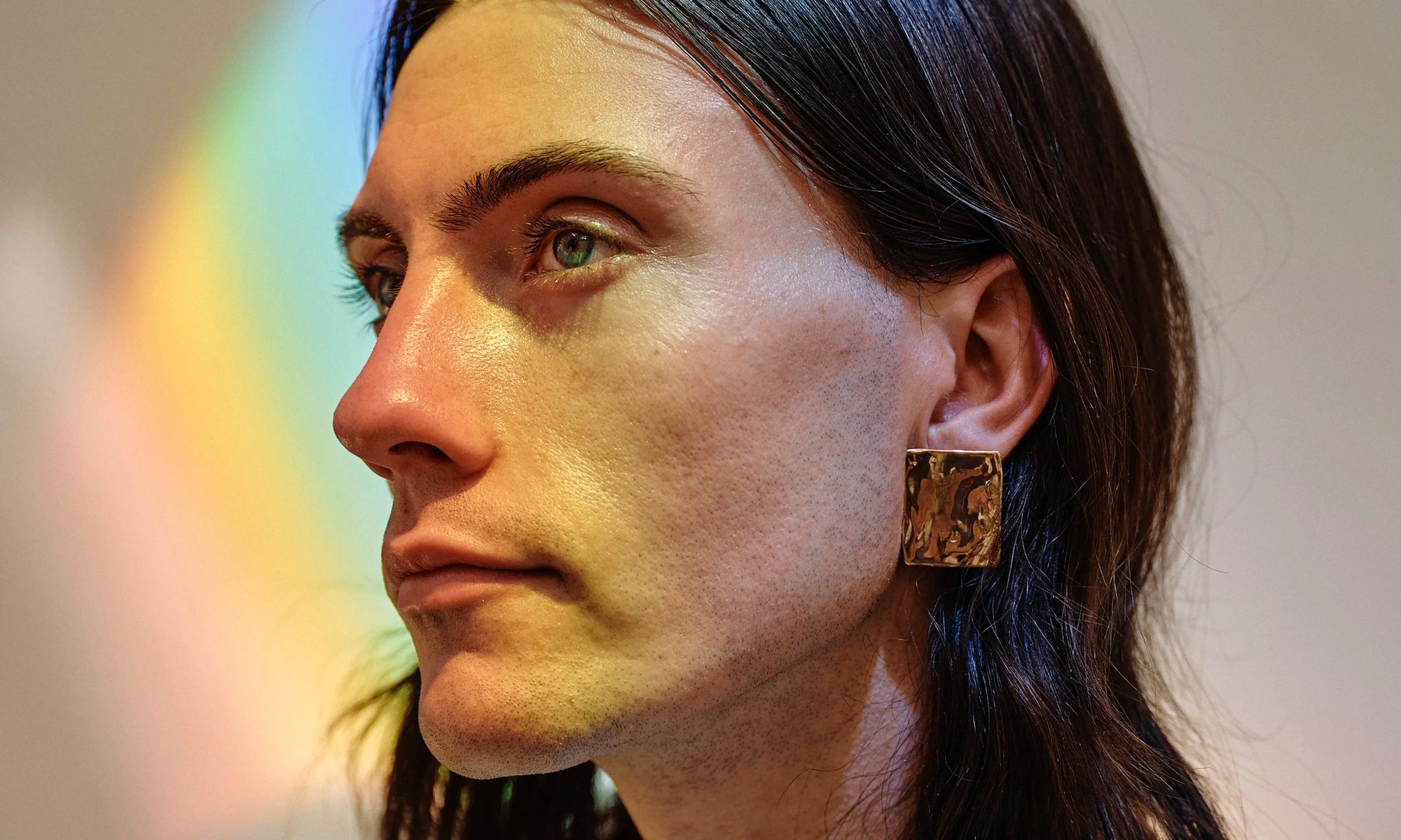 Recycled 14k solid gold rings and minimal statement earrings, hand-sculpted by Talisman Fine Jewelry. Apple wears the Plane Earrings.