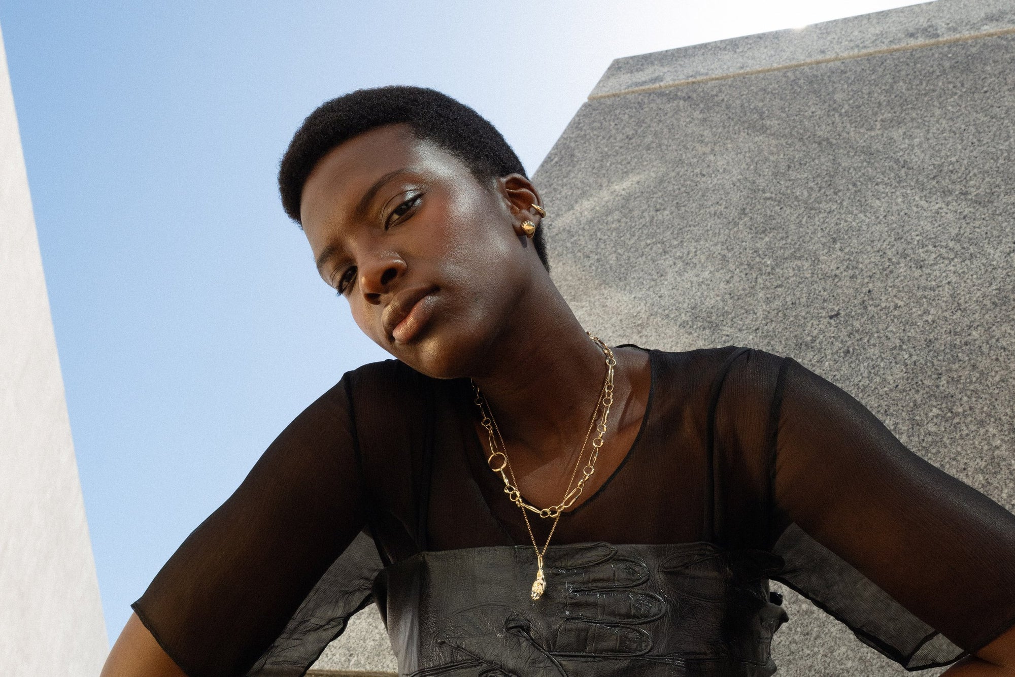 From top: Sybil Ear Cuff, Held Earrings, Metanoia Handmade Chain and the Held Necklace. All crafted in recycled 14k gold.