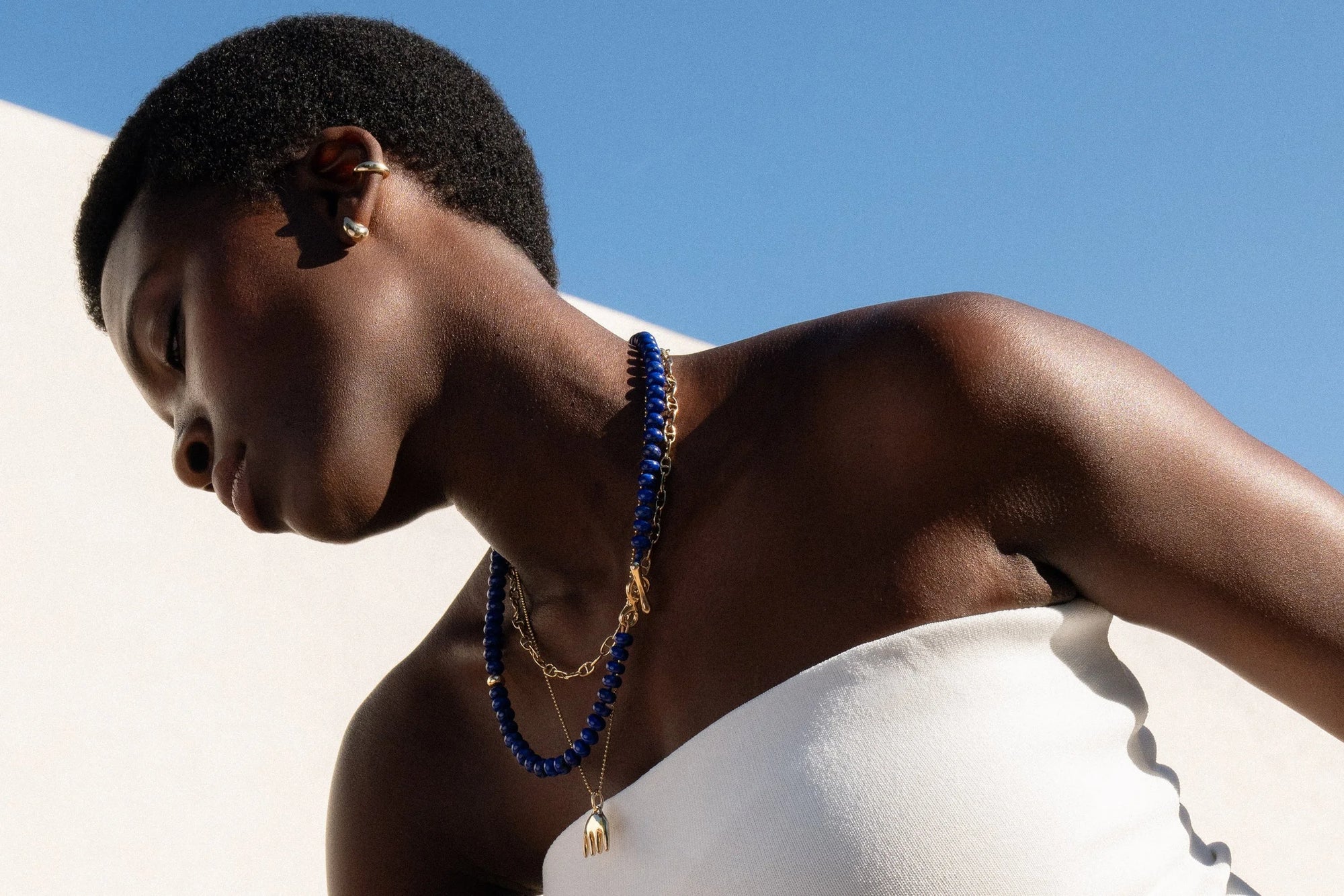 A closer look: the Metanoia Handmade Chain, the Prayer Necklace in Lapis, and Ariel's Comb Necklace.