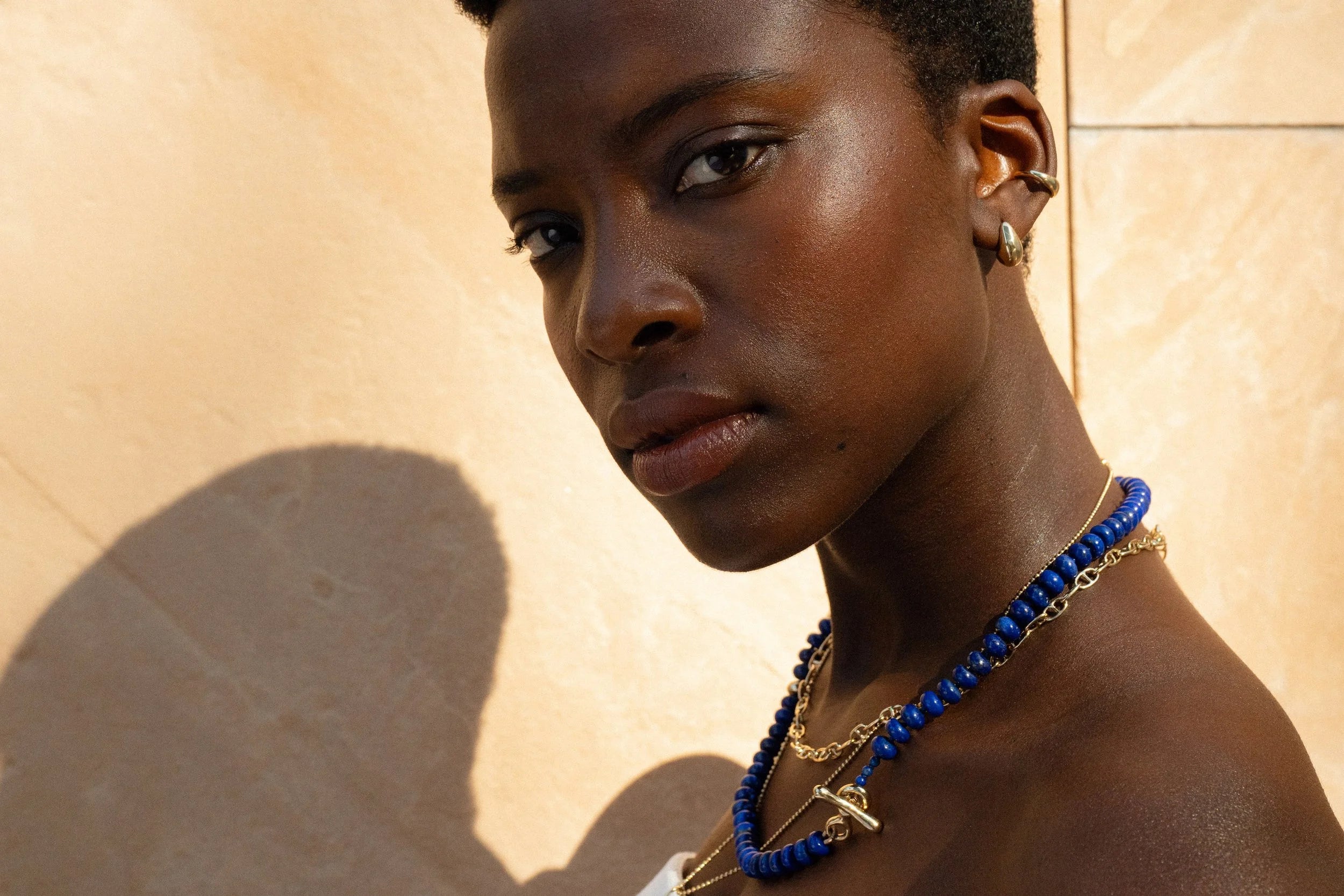 The Prayer Necklace in Lapis features a handmade toggle clasp in recycled 14k gold.