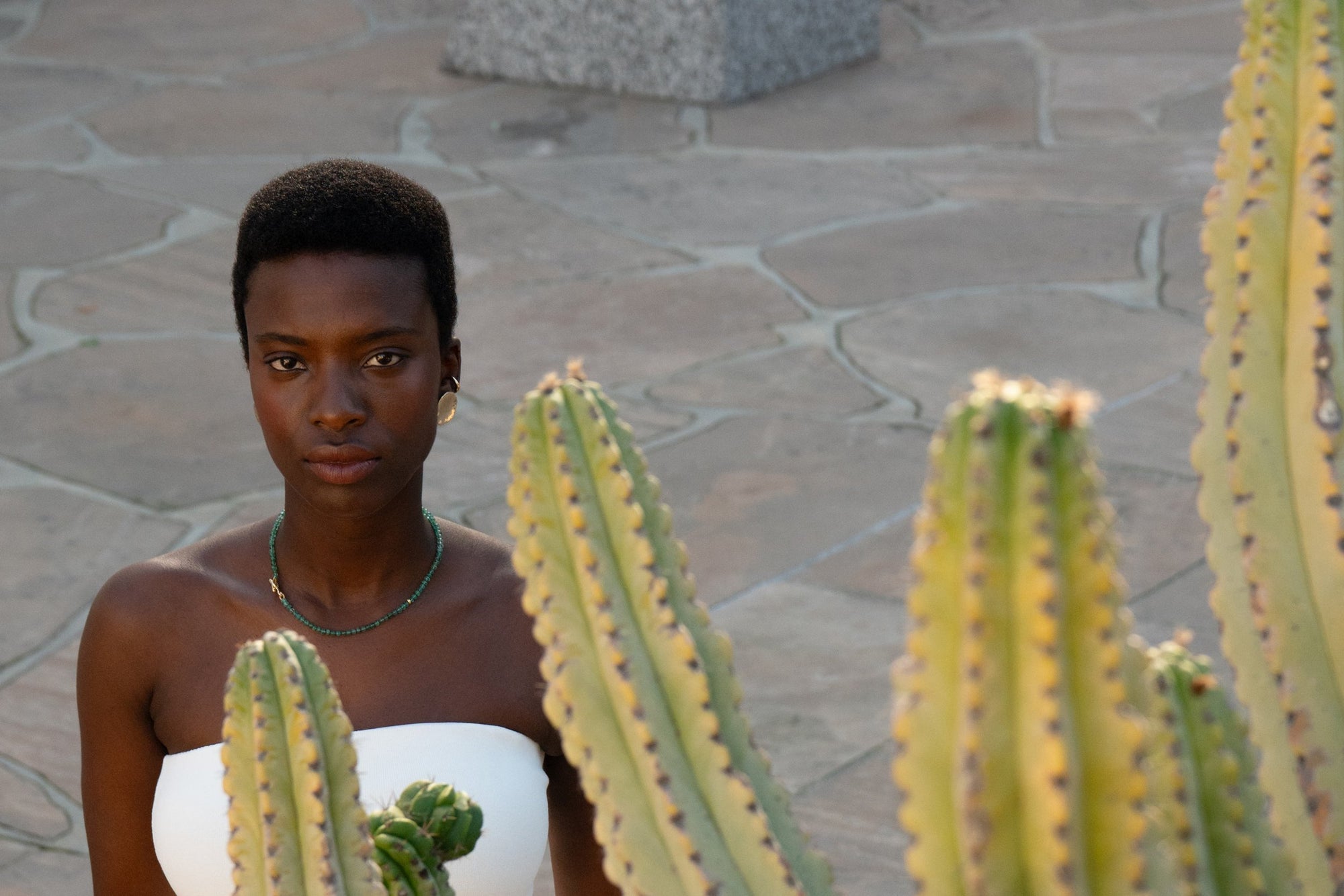 From top: the Sybil Ear Cuff, Soleil Earrings and the Prayer Necklace in Emerald. All handmade recycled 14k gold.