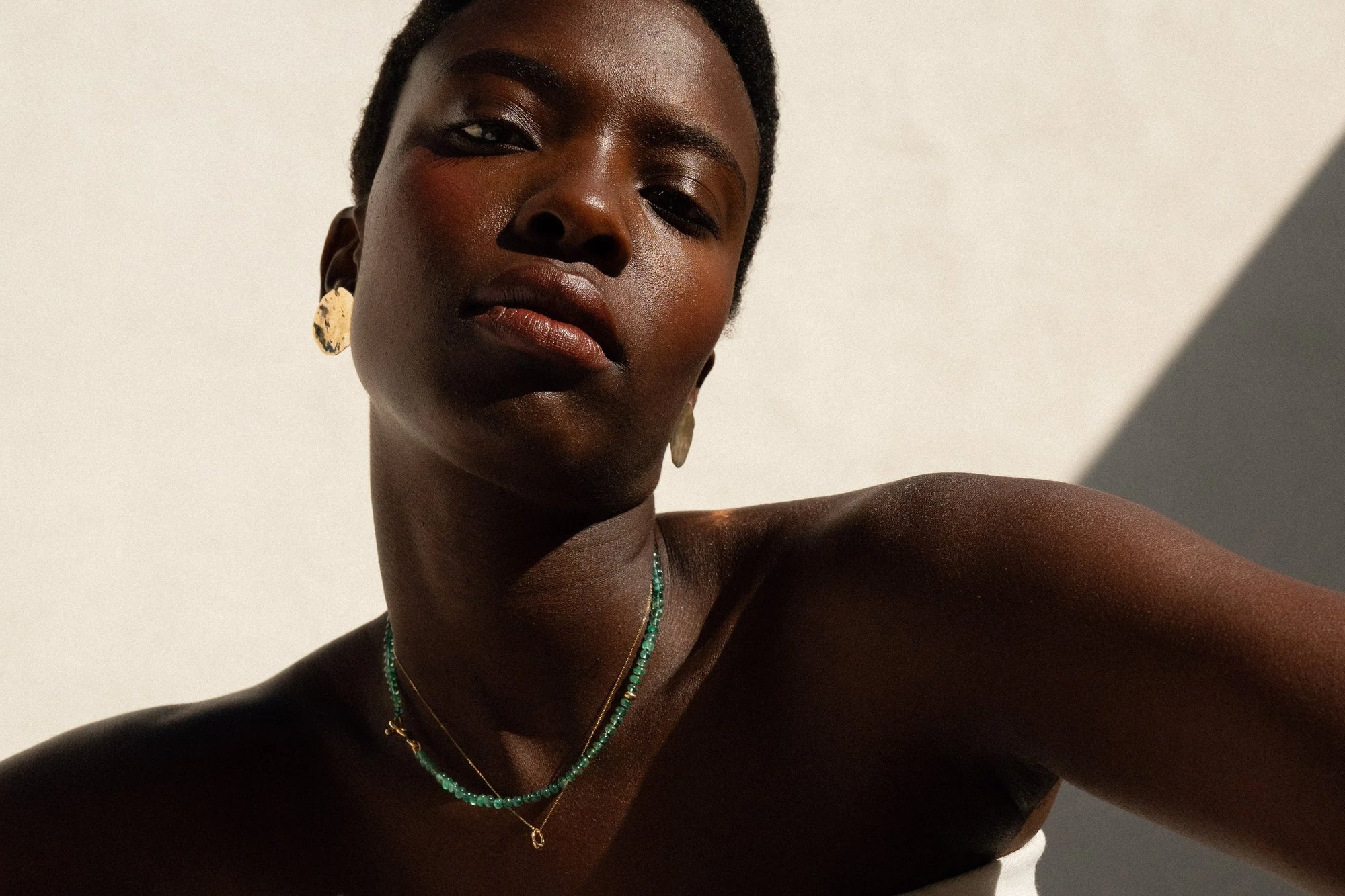 From top: Soleil Earrings, Prayer Necklace in Emerald, Fairy Ring Necklace.
