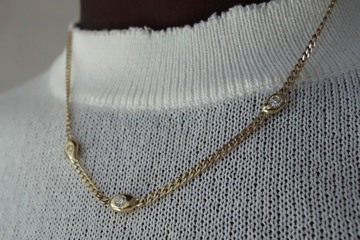 talisman fine jewelry fall 2026 constellation necklace with three mismatched diamonds set in a 14k gold curb chain