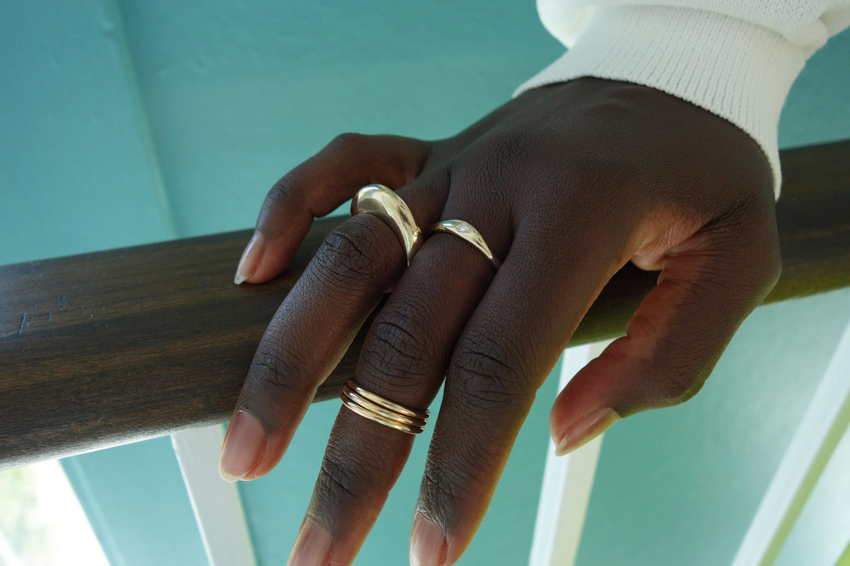 talisman fine jewelry rings from the fall 2026 collection: persephone ring, constellation ring and infinite ring stack.  all handmade in recycled 14k gold.
