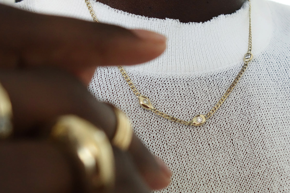 the talisman fine jewelry constellation necklace with three mismatched natural diamonds on a 14k curb chain